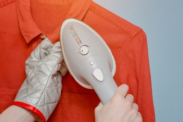 steaming an orange dress shirt
