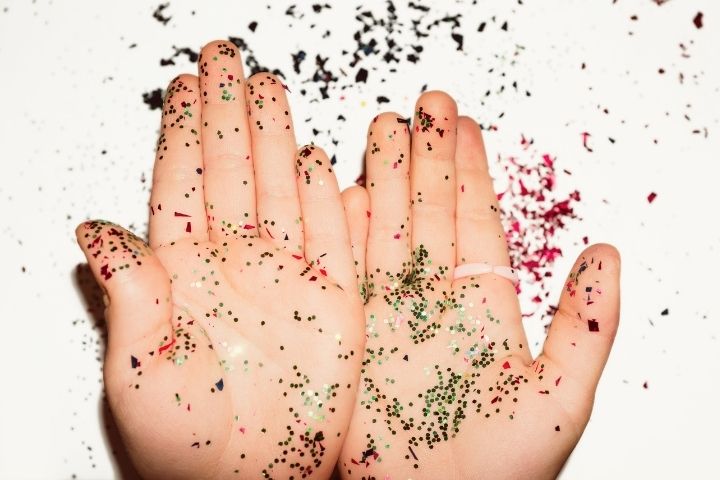 Child Hands Covered In Glitter