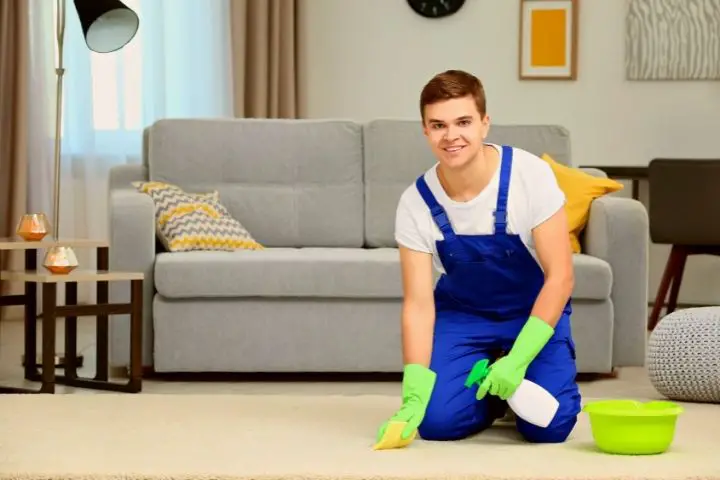 A Man Is Cleaning Carpet 1
