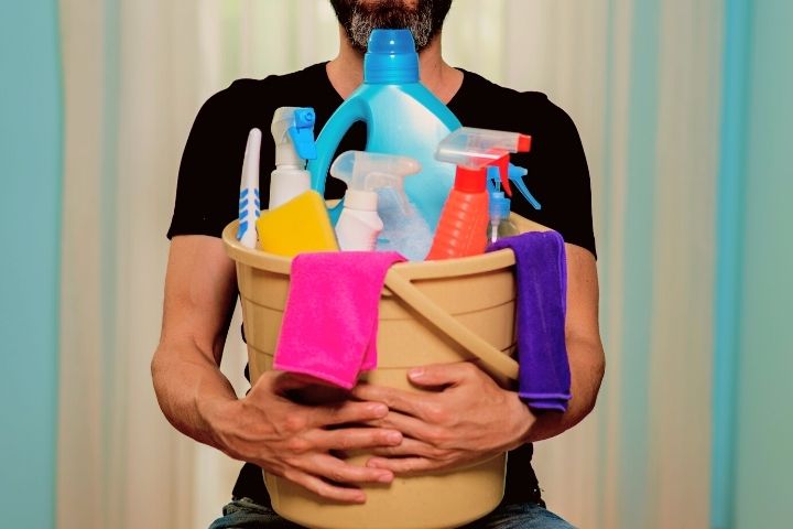 A Man With Cleaning Supplies