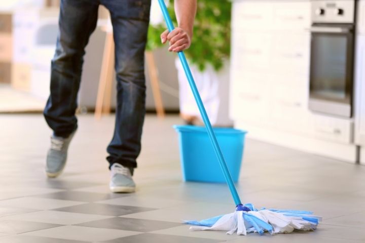 Man Is Cleaning Floor
