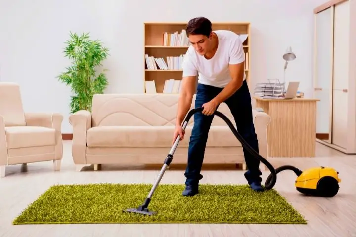 Vacuuming A Carpet